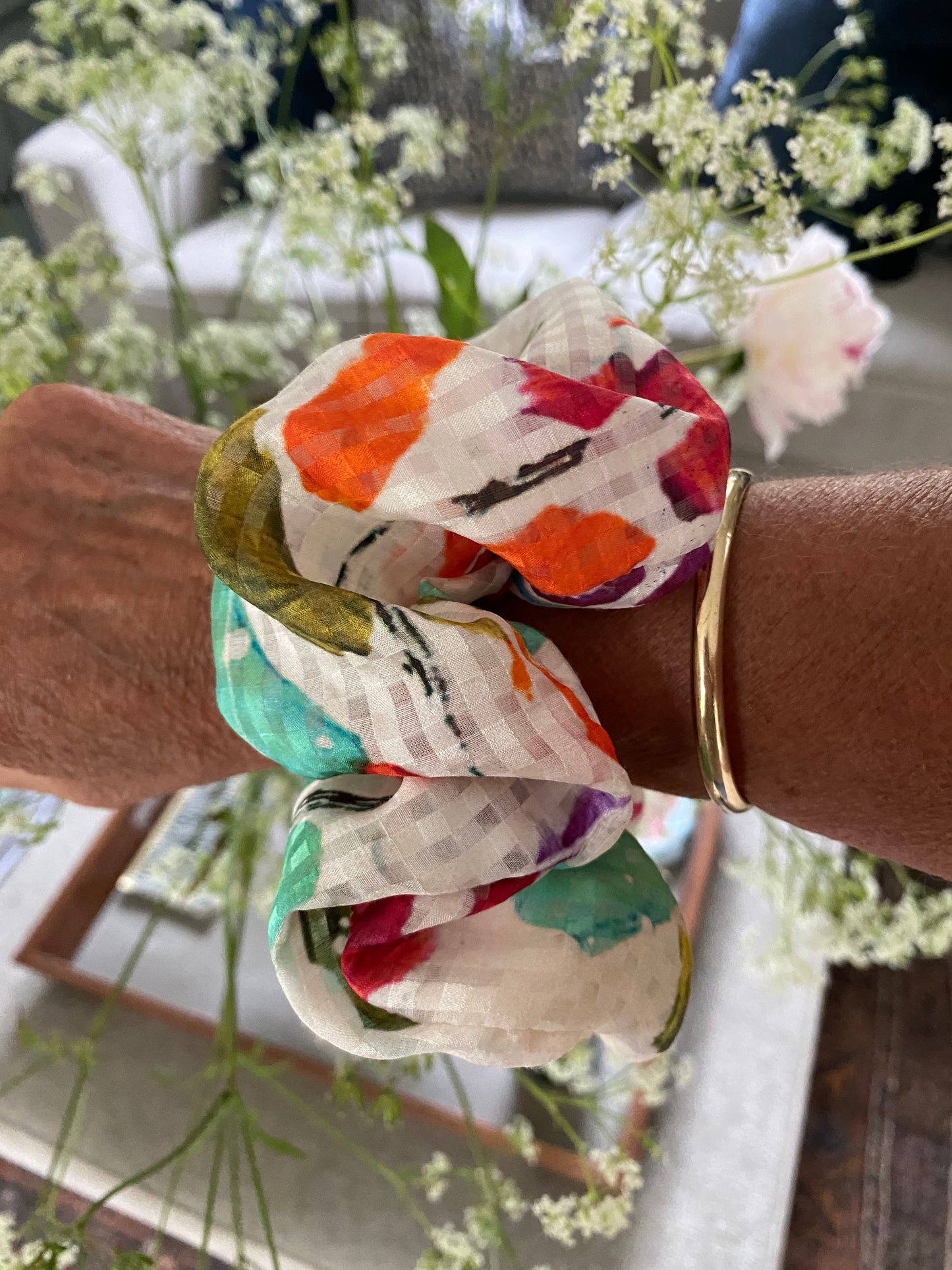 Cream silk scrunchie with splashes of turquoise, orange and pink - full