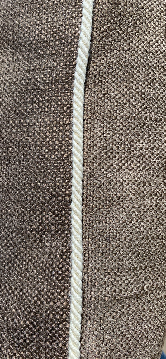 Close up of brown woven cushion and natural cord trim