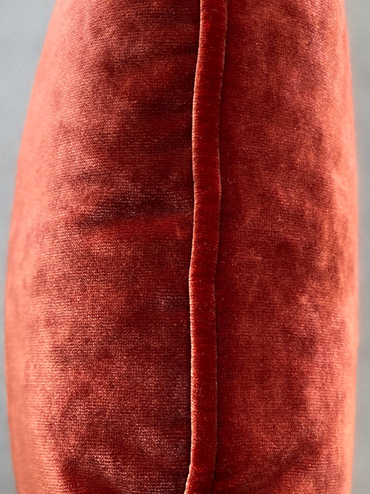 Close up of the chestnut velvet piping on the cushion