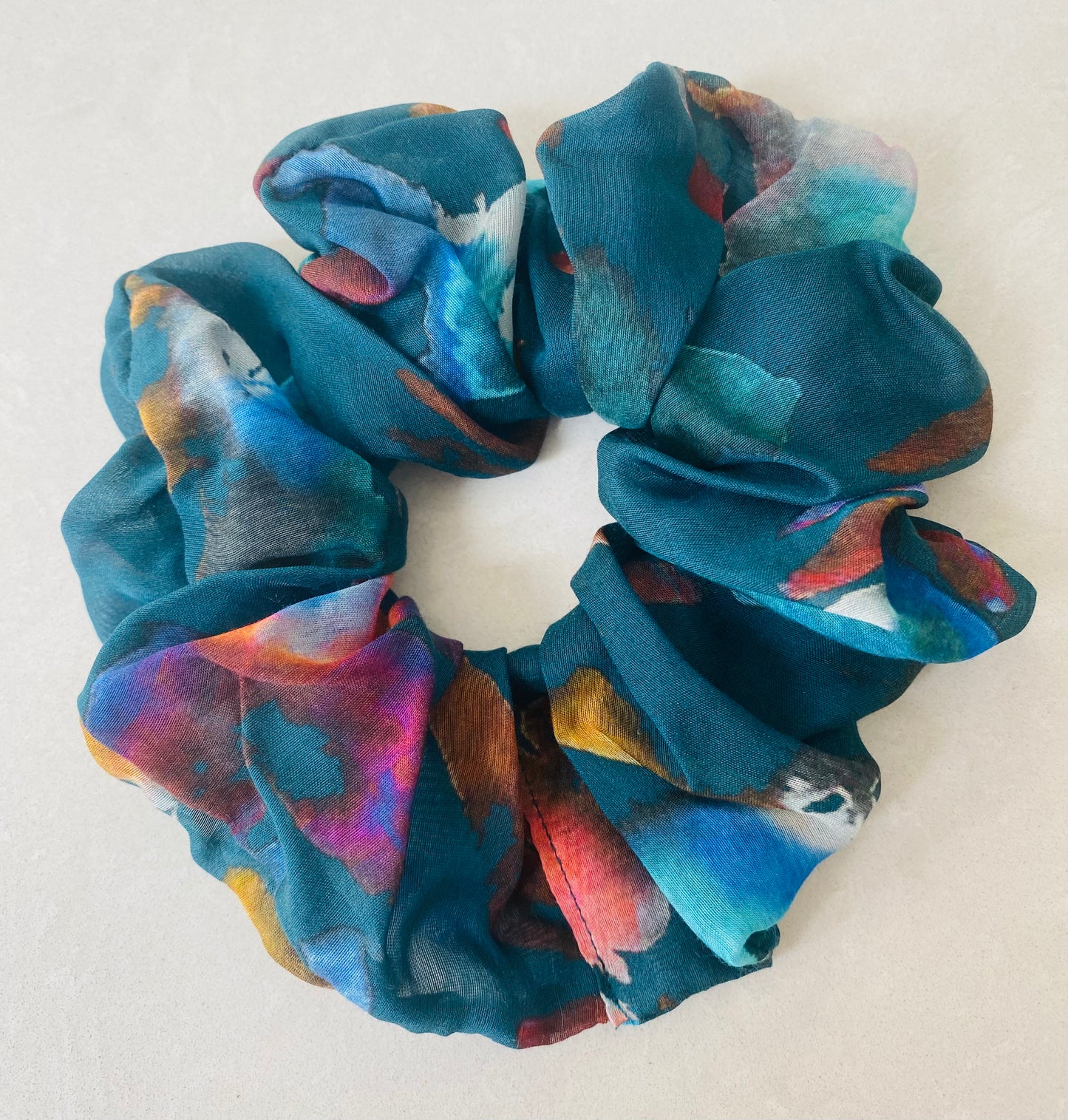 Teal silk scrunchie with splashes of pink, orange, chocolate and mauve - full