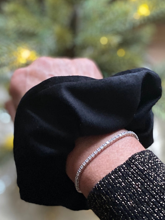 Set of two scrunchies including a black velvet and leopard print faux fur