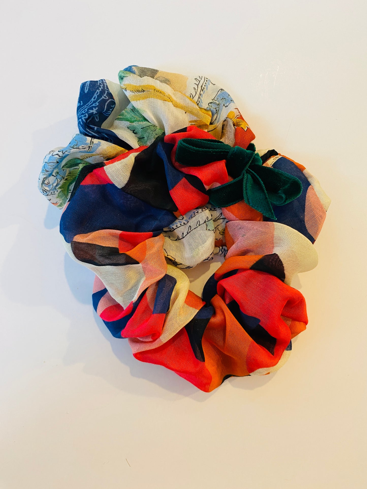 Set of two luxury silk scrunchies including a forties style patchwork and a geometric print in slim