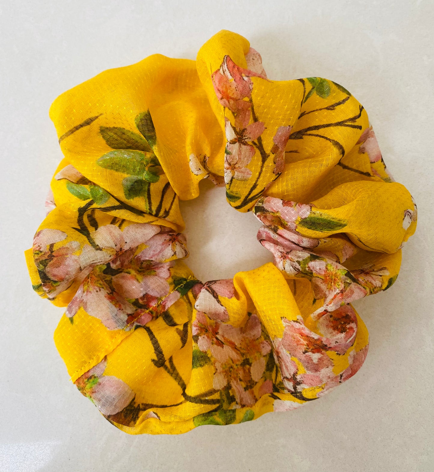 Cheerful yellow silk scrunchie with soft pink blossom - full