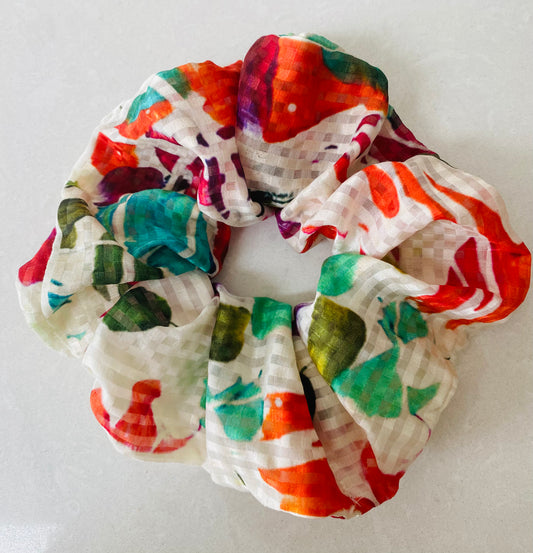 Cream silk scrunchie with splashes of turquoise, orange and pink - full