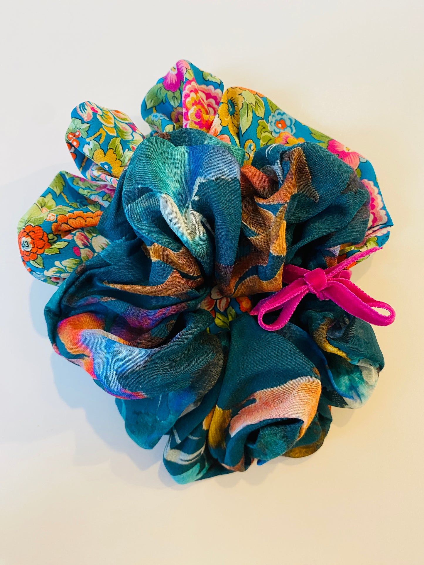 Set of two luxury silk scrunchies in a teal print and a floral design in full size