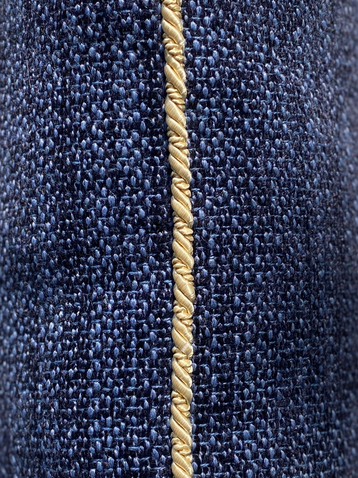 Navy chenille cushion with gold cord trim