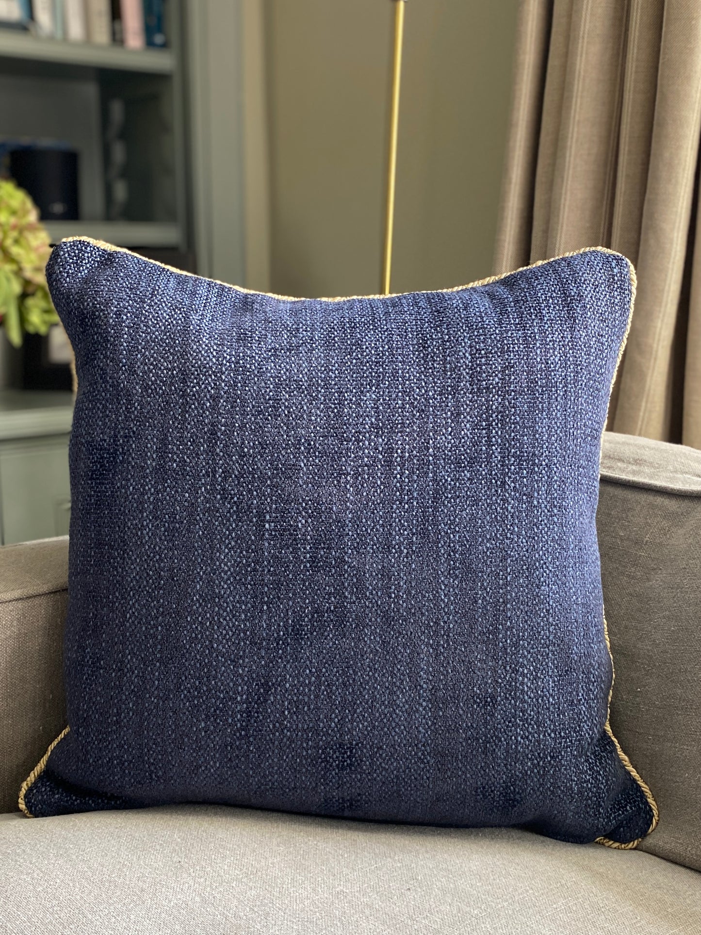 Navy chenille cushion with gold cord trim
