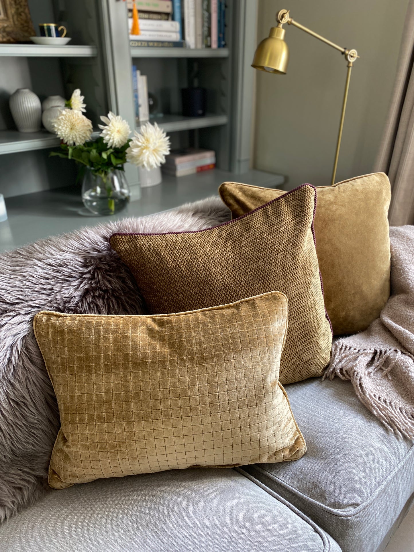 Antique gold chenille cushion with burgundy cord trim