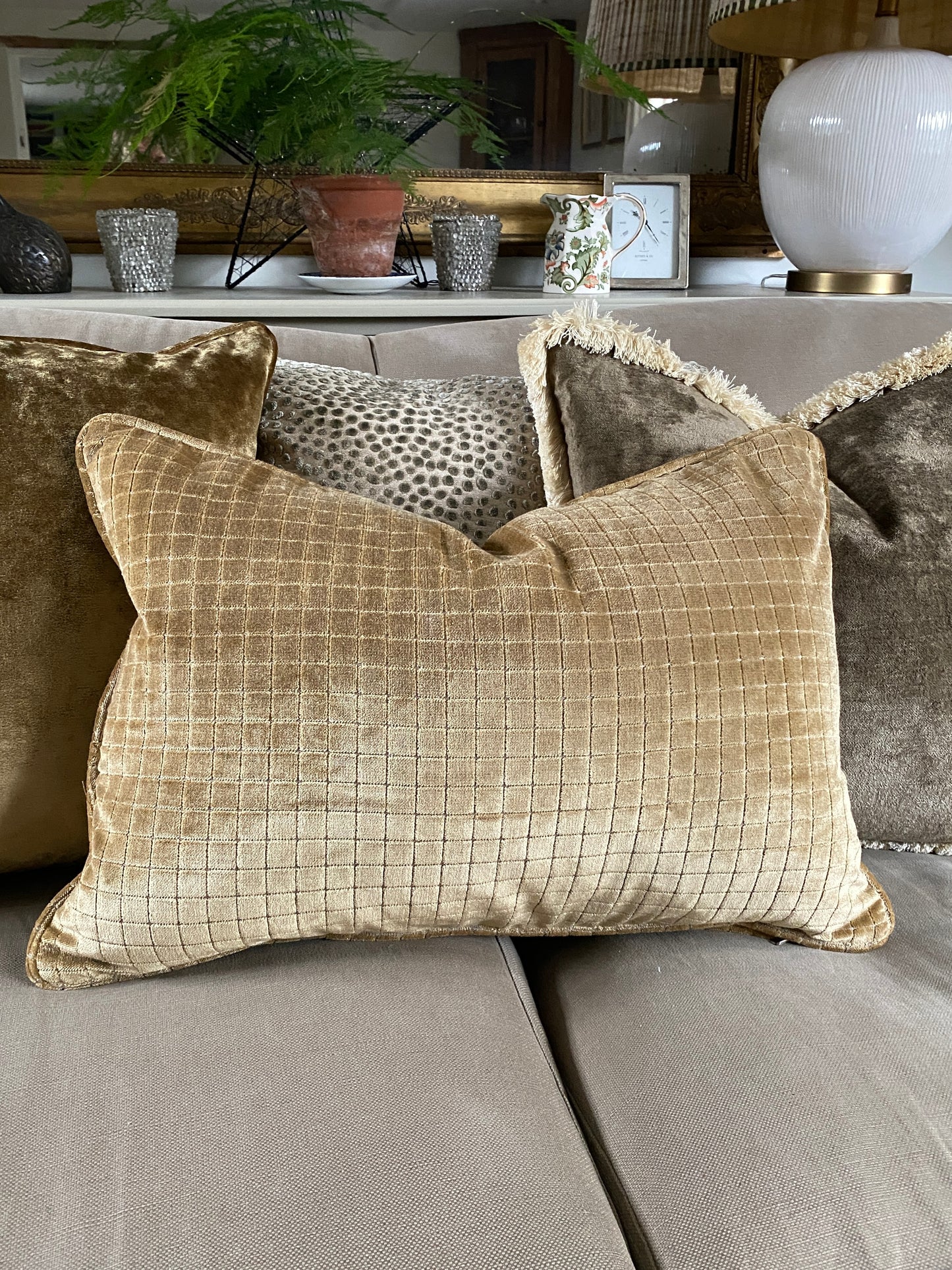 Warm gold velvet cushion