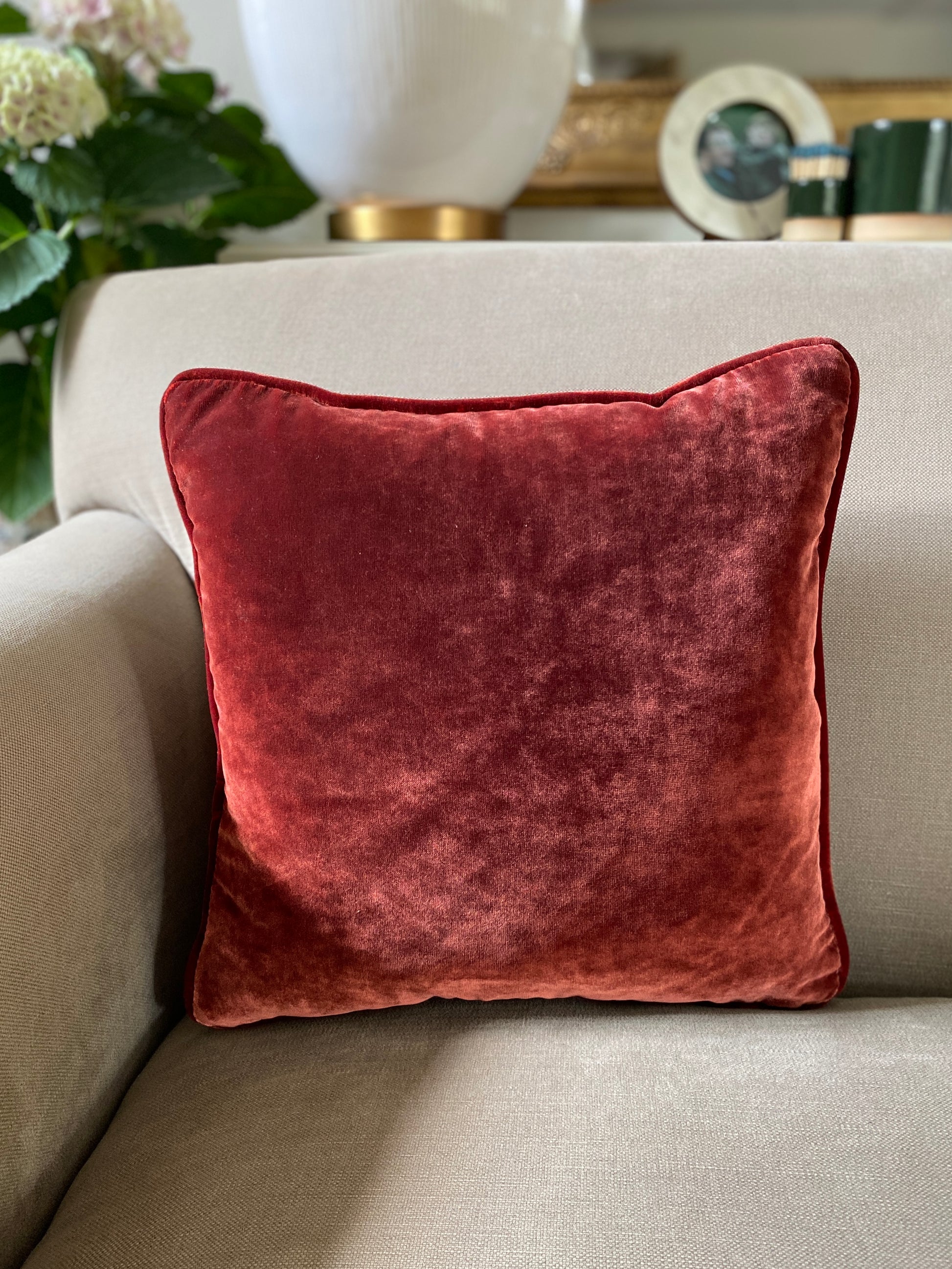 Chestnut velvet square cushion measures 38cm x 38cm and has self piping around the edges. Comes complete with feather inner pad