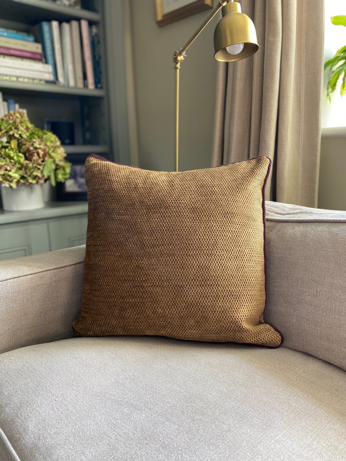 Antique gold chenille cushion with burgundy cord trim