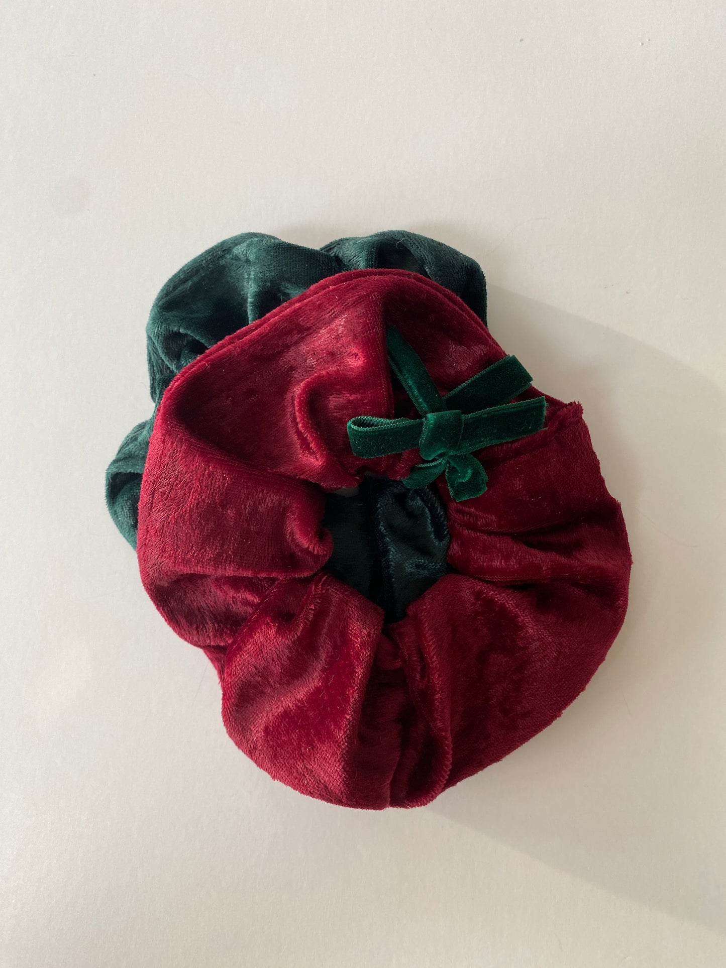 Set of two crushed velvet scrunchies in burgundy and dark green