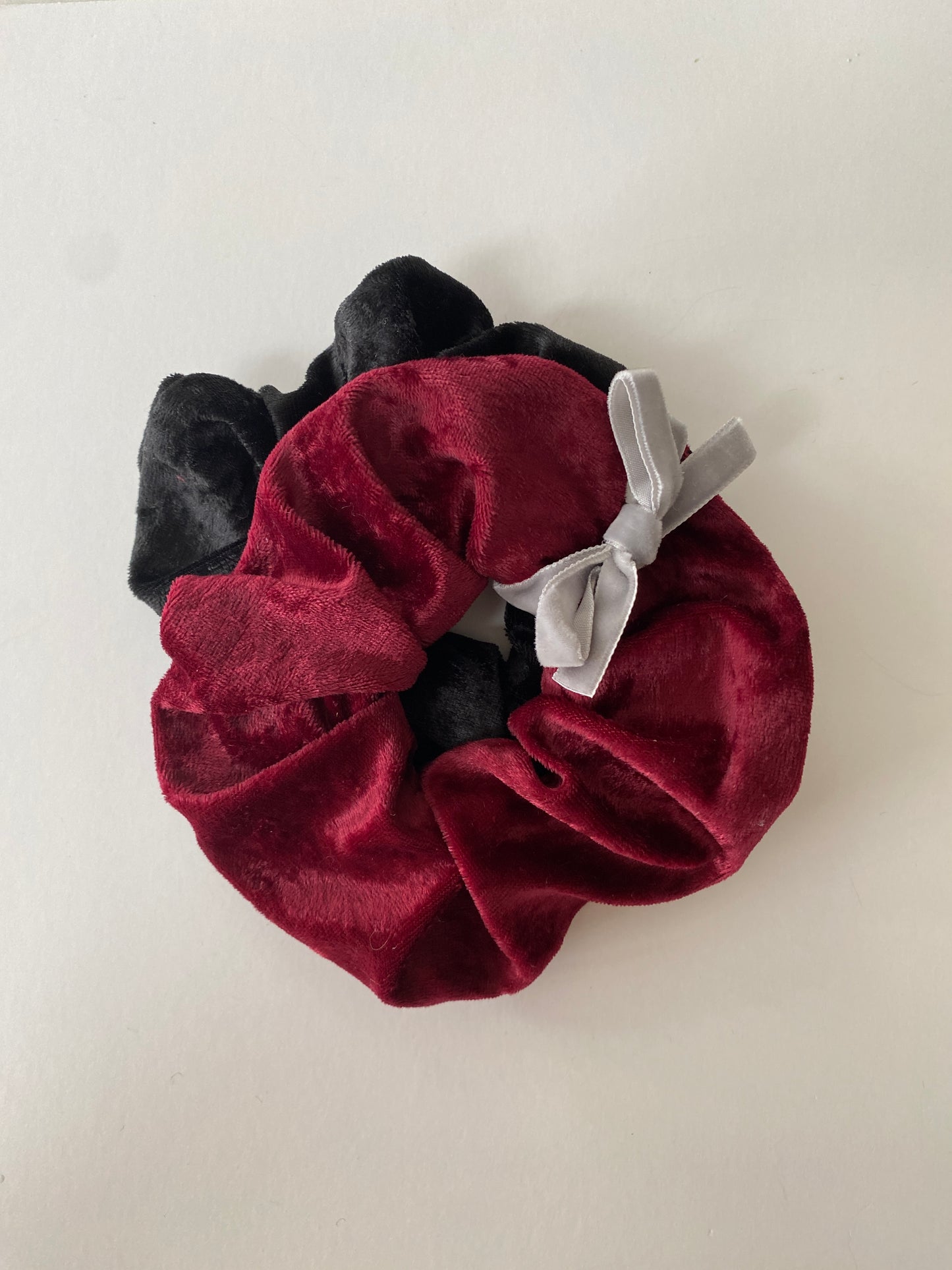 Set of two crushed velvet scrunchies in burgundy and black