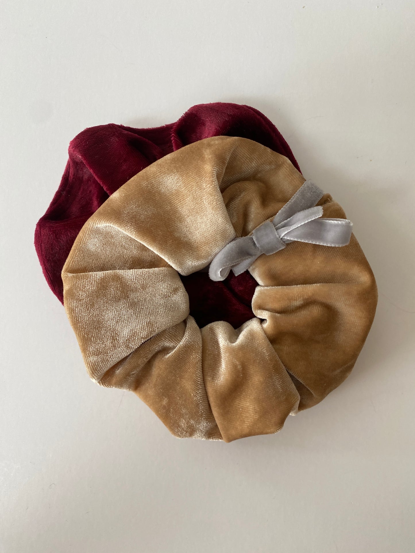 Set of two crushed velvet scrunchies in champagne and burgundy