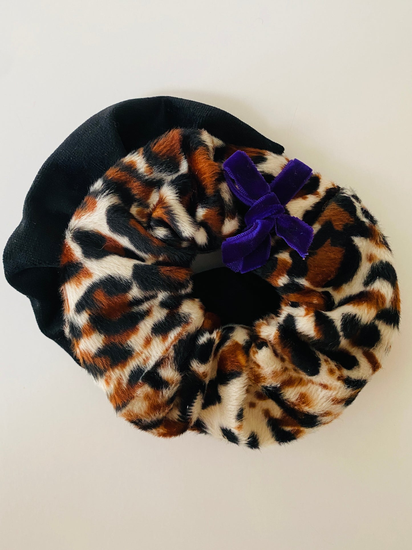 Set of two scrunchies including a black velvet and leopard print faux fur