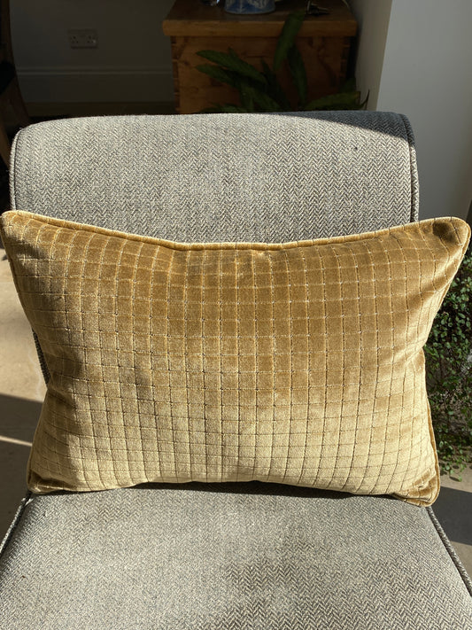 Warm gold velvet cushion