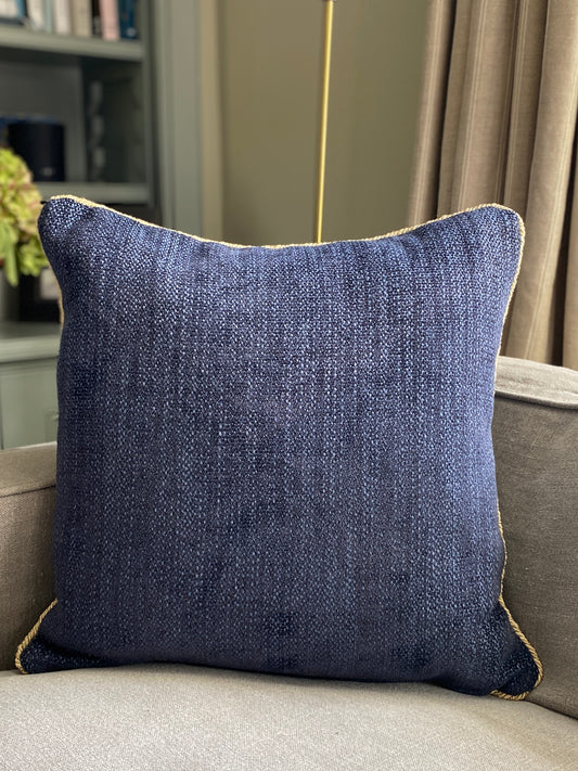 Navy chenille cushion with gold cord trim