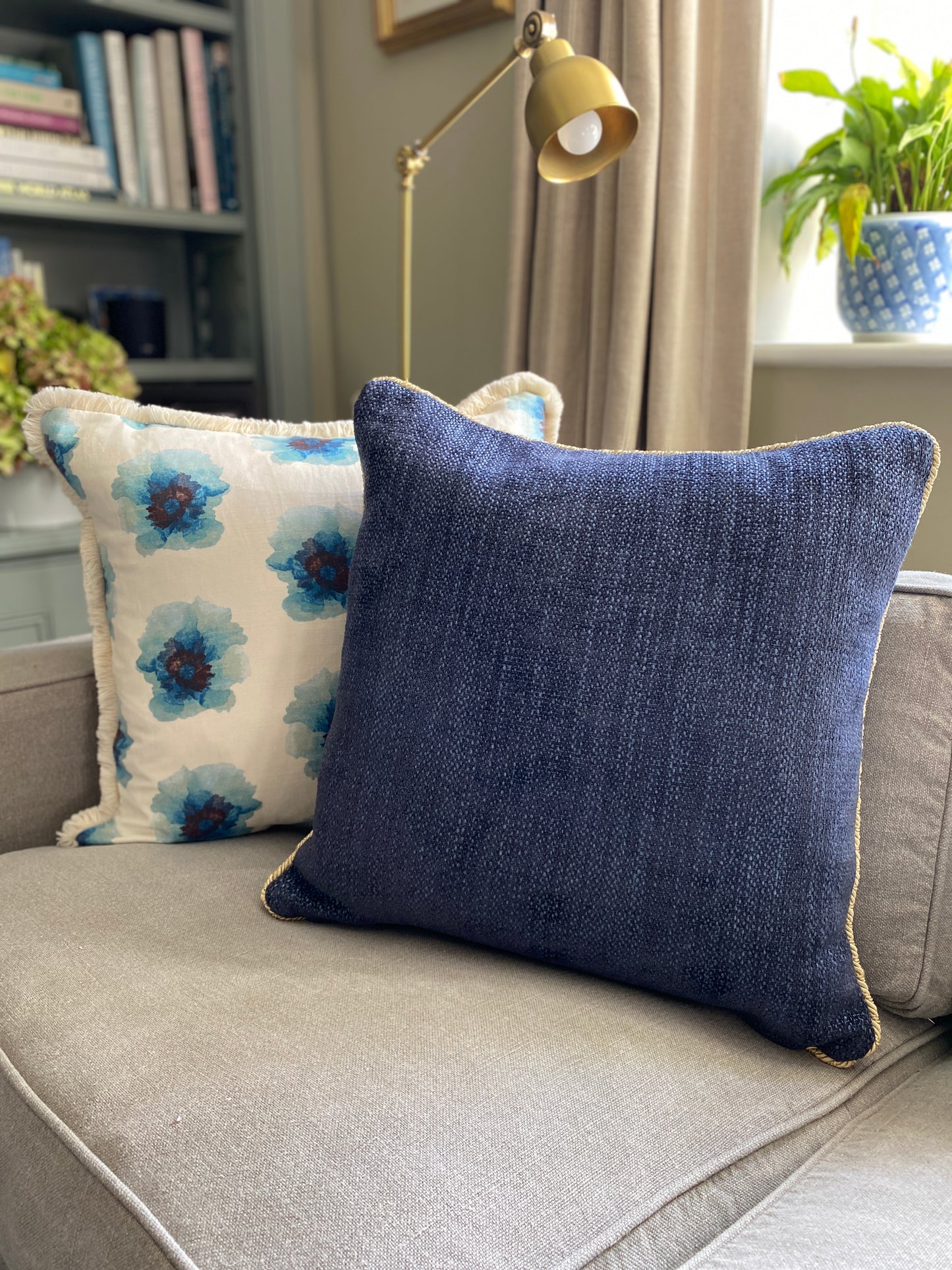 Navy chenille cushion with gold cord trim