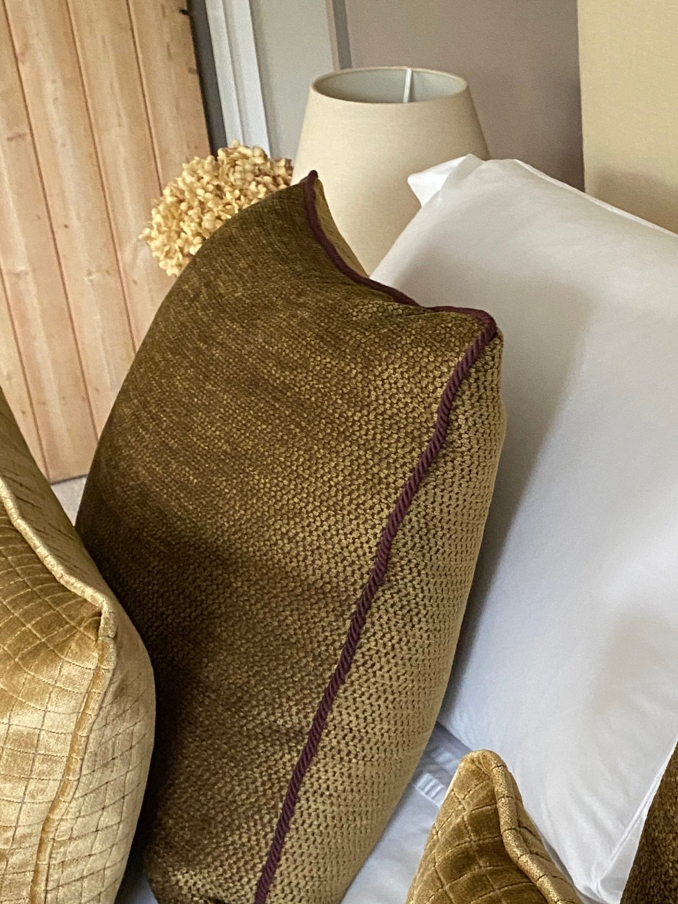 Antique gold chenille cushion with burgundy cord trim