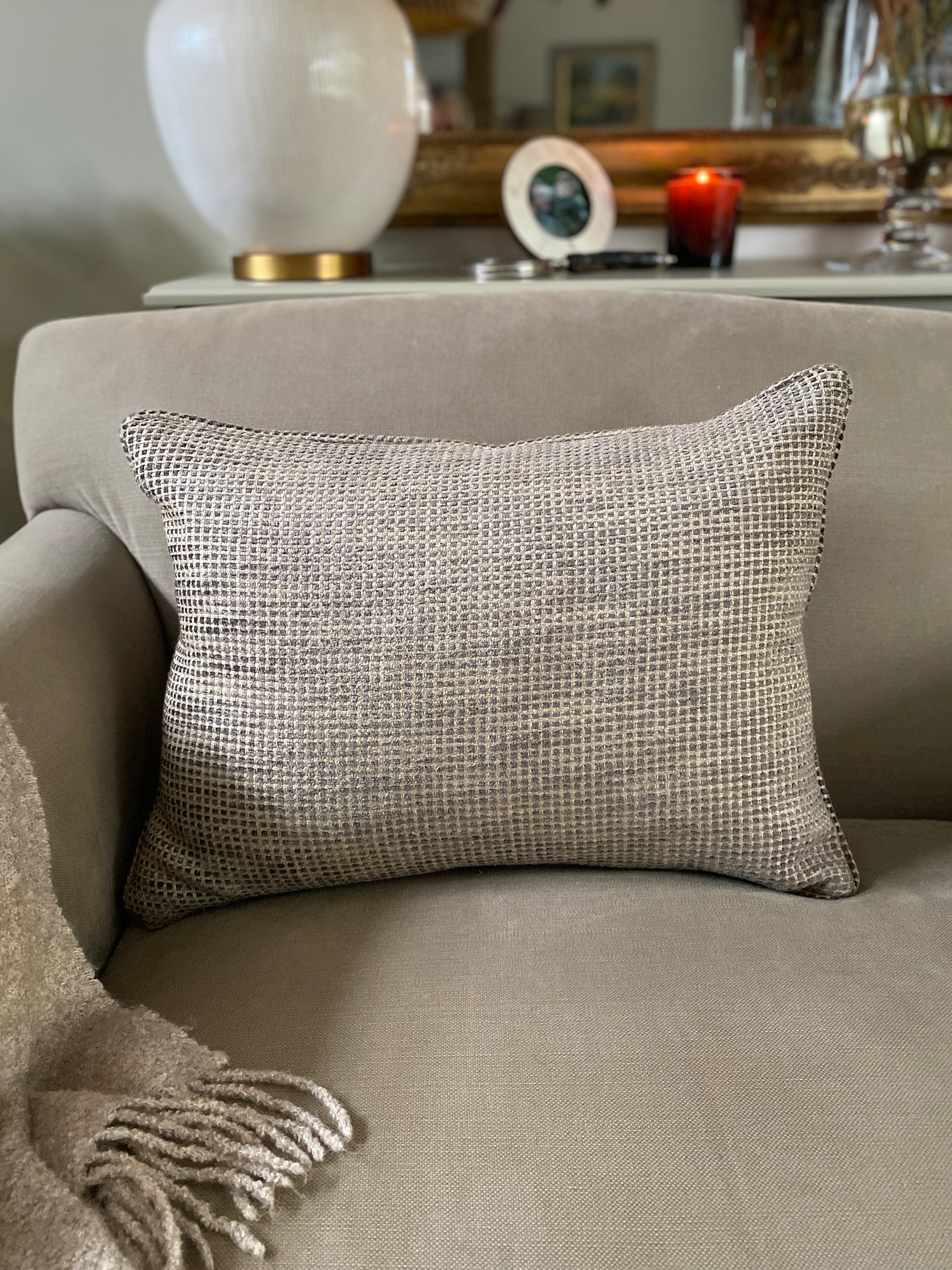 Textured chenille rectangular cushion on a sofa