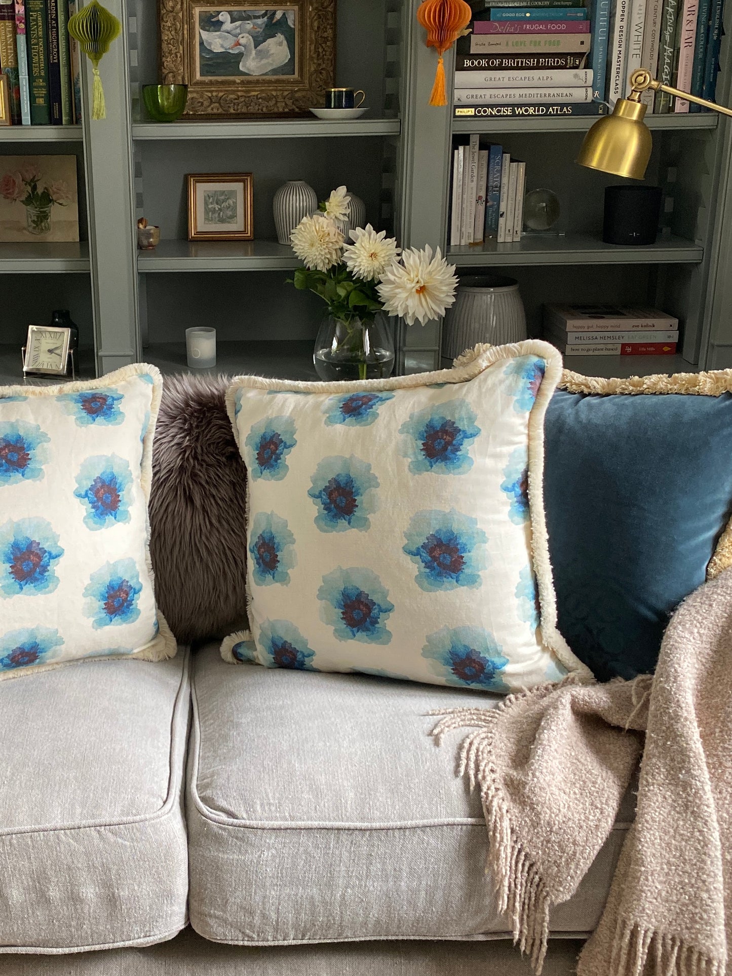 Floral linen cushion with cream fringing