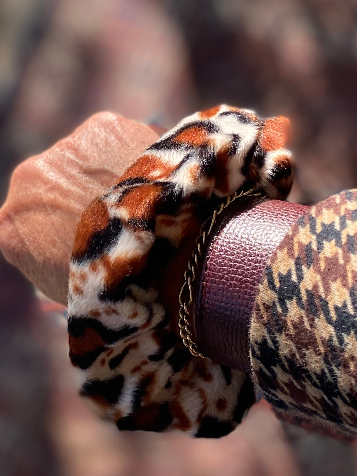 Set of two scrunchies including a black velvet and leopard print faux fur