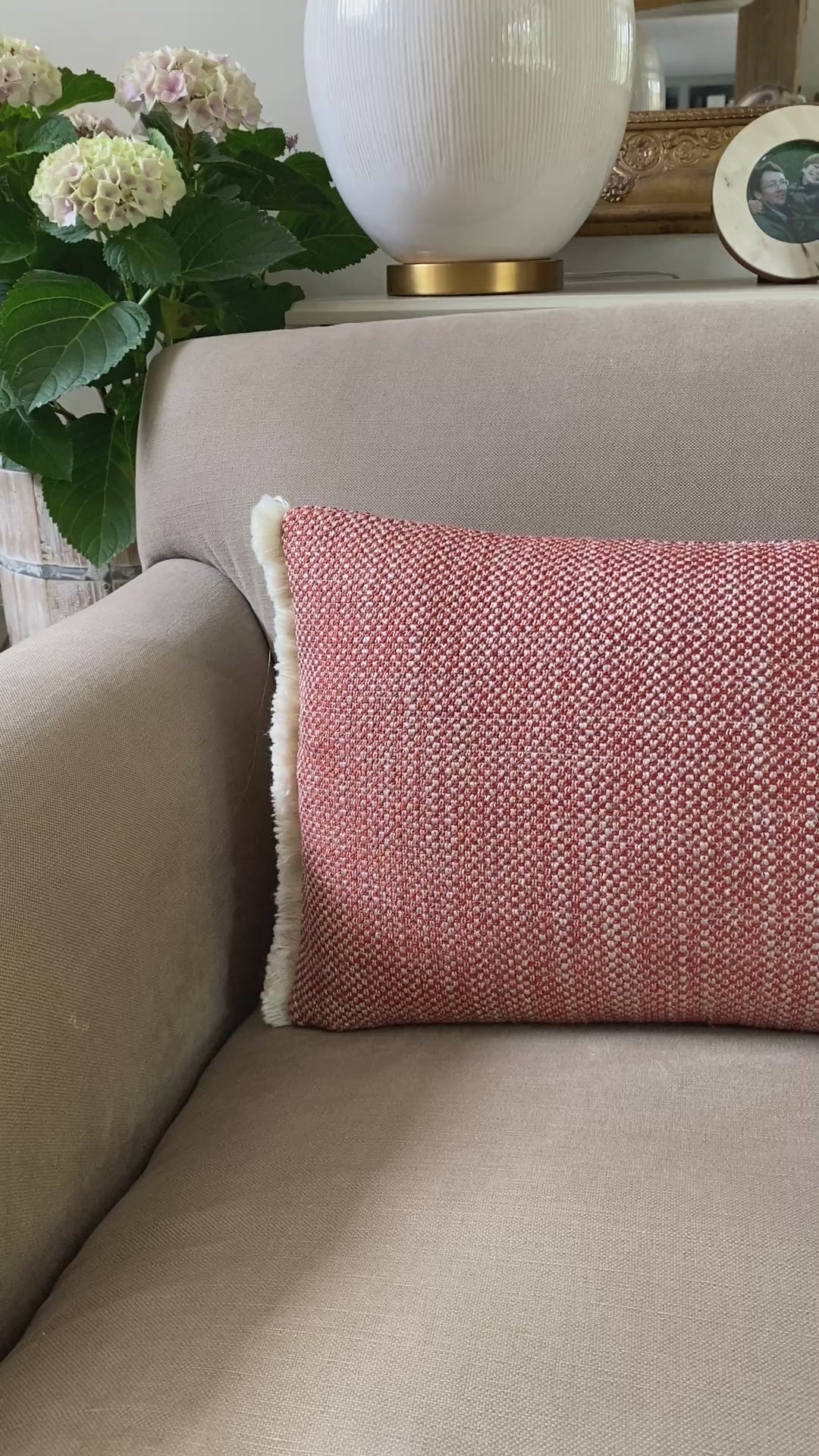 A video to show the chestnut and cream woven rectangular cushion with cream wool fringing.