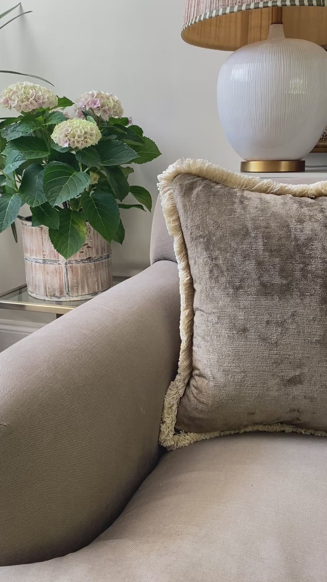 Plump brown square vintage feel cushion with fringing, measuring 48 x 48cm